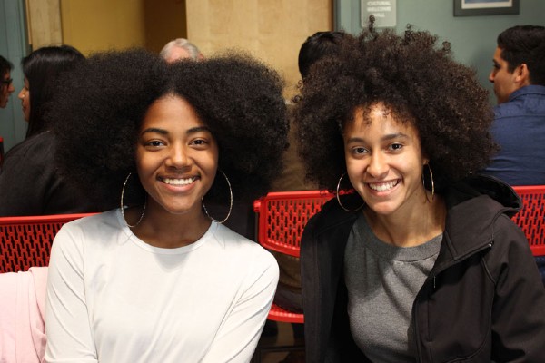 two Black women smiling to camera
